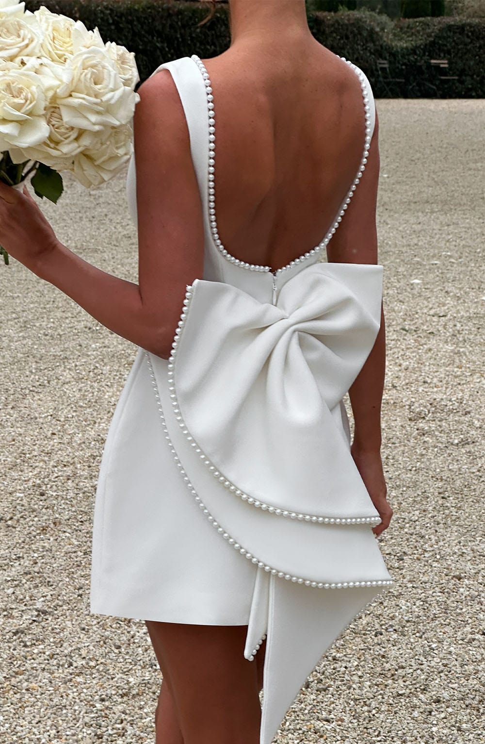 Elegant Pearl Embellished Mini Dress for Women with Boat Neck Sleeveless Bow Back Fit And Flare Cocktail Style