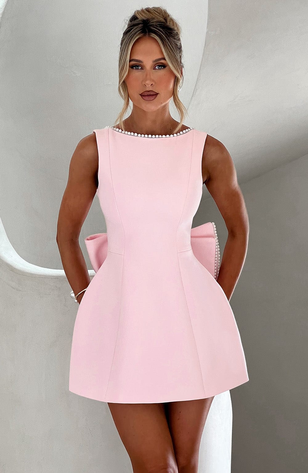 Elegant Pearl Embellished Mini Dress for Women with Boat Neck Sleeveless Bow Back Fit And Flare Cocktail Style