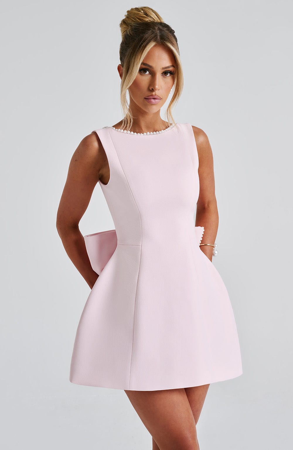 Elegant Pearl Embellished Mini Dress for Women with Boat Neck Sleeveless Bow Back Fit And Flare Cocktail Style