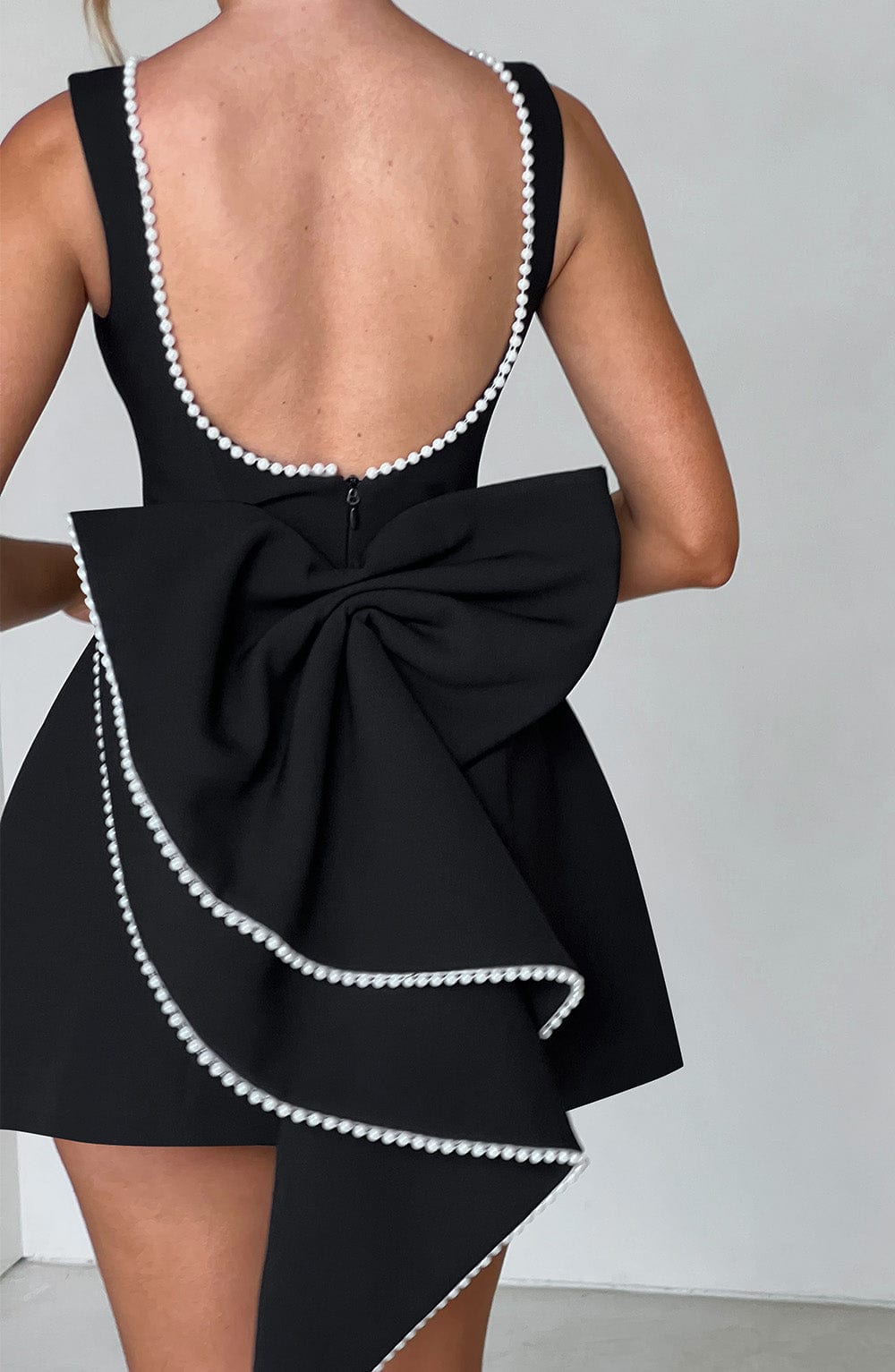 Elegant Pearl Embellished Mini Dress for Women with Boat Neck Sleeveless Bow Back Fit And Flare Cocktail Style