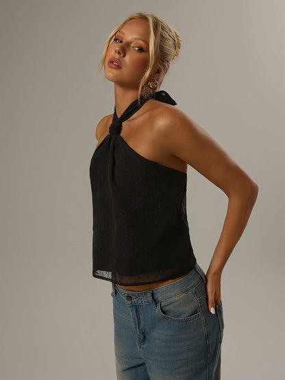 Elegant Black Swiss Dot Halter Top for Women with Twist Neck Open Back Cropped Flowing Style