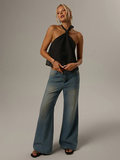 Elegant Black Swiss Dot Halter Top for Women with Twist Neck Open Back Cropped Flowing Style